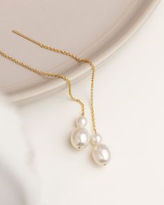 "Ear Thread Earrings with Pearl in Gold filled or Sterling Silver Elegant drop earring featuring freshwater pearls with dainty Gold Fill or Sterling Silver chain. Perfect bridesmaids gift or for bridal jewelry * 1 Pair * Total length of the threader measures about 3.5\" from end to end * Sterling silver or Gold filled * Fresh water pearls * Perfect gift for Bridesmaids, Bride Our pearl jewelry: https://www.etsy.com/shop/EandEProject?ref=simple-shop-header-name&listing_id=1230926220&search_query= Delicate Dangle Pearl Pendant Earrings, Delicate Pearl Pendant Dangle Earrings, Delicate Dangle Bridal Earrings With Pearl Pendant, Delicate Bridal Dangle Earrings With Pearl Pendant, Elegant Teardrop Threader Earrings For Wedding, Delicate Dangling Beads Earrings For Wedding, Pearl White Drop Earrings With Pearl Chain For Bridal, Delicate Pearl Drop Linear Earrings, Pearl White Dangle Bridal Earrings With Pearl Pendant