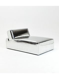 a metal object sitting on top of a white surface