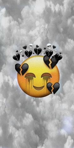 an emoticive smiley face floating in the air surrounded by black and white clouds