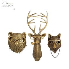 three animal heads with glasses on them and one is wearing a deer's head