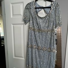 a dress hanging up on a door