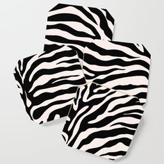 three pieces of black and white paper with zebra print on them, one is folded to the side