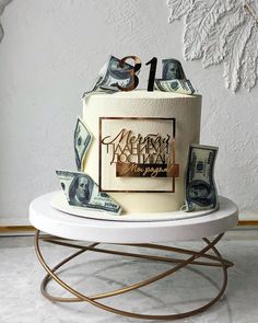 a birthday cake with money on top