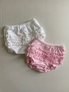 Buy 2 and save. Made of 100% pima cotton. Super soft and perfect for cover up those diapers. Comes with one of each color-solid white and solid pink. White Cotton Bloomers With Elastic Waistband, White Cotton Bloomers With Ruffles, Pink Ruffled Bottoms For Playwear, White Cotton Ruffled Bloomers, White Bloomers For Playtime In Spring, White Bloomers For Spring Playwear, Spring White Bloomers For Playwear, Pink Cotton Bloomers With Ruffles, White Ruffled Bottoms For Playwear