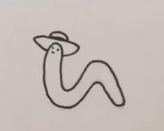 a black and white drawing of a person wearing a hat with a snake on it