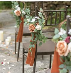 the chairs are decorated with flowers and greenery for an outdoor wedding ceremony or reception