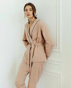 These natural pajamas are made of soft cotton knitwear fabric (jersey) and are perfect for sleep, parties, or everyday use. Our luxurious, temperature-regulating knit fabric drapes and falls in all the right ways, enveloping the body in comfort. Plus, it's machine washable and gentle on the skin, so it not only feels beautiful but it's easy to care for, too. These are the cozy, relaxed PJs you'll live in, a gift to everyone, and pack with you wherever you go. Composition: 95% cotton, 5% elastin (it helps to be like a second skin because of stretching features) We could advise more colors for this set: black, beige, white, dark blue, and light pink. Please, write to me, if you want to change the color. The set includes a long sleeve kimono and matching pajama pants. With pockets. We suggest Spring Lounging Wrap Sleepwear, Cotton V-neck Lounging Sets, Cotton V-neck Sleepwear For Loungewear, Cotton Lounging V-neck Sets, Cotton Lounging Sets With V-neck, Beige Long Sleeve Sleepwear Set, Beige Long Sleeve Sets For Home, Beige Long Sleeve Sleep Set, Beige Cotton Home Sets