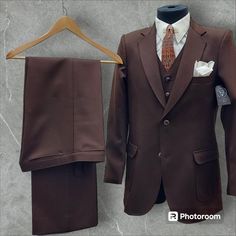 Presented is a 3 piece brown Angel's Flight Suit. Suit is in good condition with no holes, tears, stains or odors. Cuffs and collar of the suit are in good condition.  The Angel's Flight label was very popular in the 70's. Many of their suits had that 1930's look to them with belted backs and reverse pleats. Suit is labeled a 42R but fits more like a size 40. For best fit results, go by measurements below. Suit is along the lines of a Slim fit. Coat: Shoulder to shoulder:  17.5" Pit to Pit:  20" Shoulder seam to sleeve end:  25.5" Shoulder seam to bottom hem:  29.5" Top of back collar to hem:  32" 2 Front Buttons / Cuffs have 3 buttons each Flap pockets w/ reverse pleats Belted Back with pleating Left inside pocket Fully Lined  Slacks Waist:  30" ( no let out possible) Outseam (waist to he Angel Flight, Slim Fit Coat, Flight Suit, Brown Suits, Sport Coat, Mens Suits, Inside Pocket, 3 Piece, Slim Fit