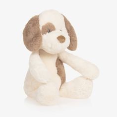 a stuffed dog sitting on the ground