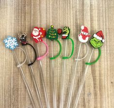 six christmas headbands with santa claus, snowman, and other holiday decorations