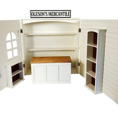 a doll house with all the furniture and accessories in it's storage area, including a bench