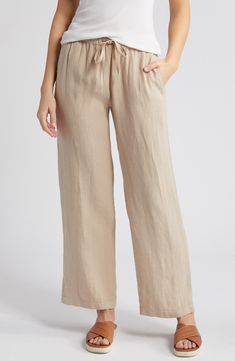 These lightweight linen pants are cut with straight legs and topped with a comfortable elastic-drawstring waist. 29 1/2" inseam; 22" leg opening; 11" front rise; 16" back rise (size Medium) Elastic/drawstring waist Front slant pockets; back patch pockets 100% linen Machine wash, line dry Imported Navy Blue Sundress, Tan Linen Pants, Linen Pants Outfit, Coastal Grandmother, Ageless Style, Flowy Maxi Dress, Wide Leg Linen Pants, Summer Staples, Wide Brimmed Hats