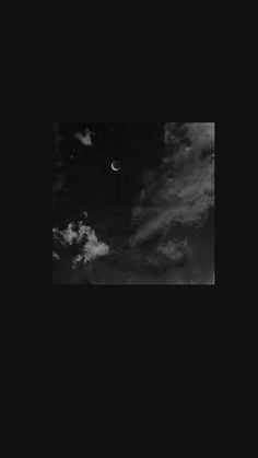 black and white photograph of the moon in the sky