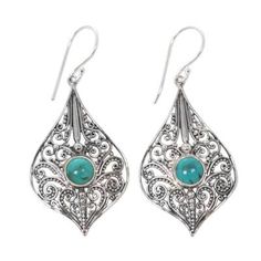 Lacy wire and beadwork in the traditional Balinese style forms a pretty background for turquoise gemstones. Komang Suastra of Bali crafts the dangle earrings from sterling silver and adds cabochons of reconstituted turquoise in this feminine design. Elegant Turquoise Earrings For Summer, Bohemian Sterling Silver Filigree Teardrop Earrings, Turquoise Bohemian Earrings With Intricate Design, Bohemian Turquoise Earrings With Intricate Design, Turquoise Filigree Earrings As Gift, Turquoise Filigree Earrings For Gift, Elegant Turquoise Teardrop Pierced Earrings, Fall Jewelry Trends, Dangle Earrings Gold