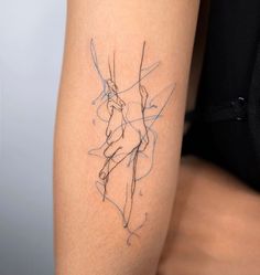 a woman's arm with a tattoo on it that has lines in the shape of a horse