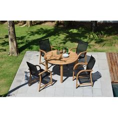 an outdoor table and chairs on a patio