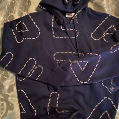 Very Nice And Comfy Fila Hoodie. Navy Blue Is The Color. Brand New. Never Worn. Navy Casual Sweatshirt With Adjustable Hood, Navy Hooded Top With Letter Print, Navy Letter Print Hoodie Sweatshirt, Navy Hooded Sweatshirt With Letter Print, Navy Long Sleeve Hoodie With Letter Print, Blue Letter Print Athleisure Hoodie, Navy Long Sleeve Hoodie With Adjustable Hood, Casual Navy Hooded Sweatshirt, Blue Sporty Hoodie With Graphic Print