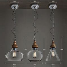 three glass pendant lights hanging from the ceiling, with measurements for each bulb and size