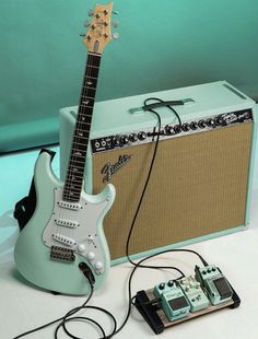 an electric guitar and amp sitting next to each other