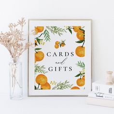 an orange print with the words cards and gifts on it next to a vase filled with flowers