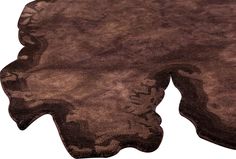 an area rug that looks like it is made out of brown and black furs