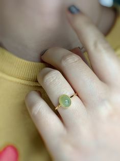 Elegant Green Opal Oval Ring, Oval Jade Rings In Yellow Gold, Luxury Green Oval Opal Ring, Elegant Green Opal Ring Oval Cabochon, Elegant Green Opal Ring With Oval Cabochon, Oval Cabochon Emerald Ring In Yellow Gold, Yellow Gold Oval Cabochon Emerald Ring, Yellow Gold Emerald Ring, Oval Cabochon Gift, Modern Oval Jade Ring