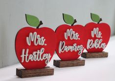 three wooden apples with the words mr and mrs written on them