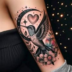 a tattoo with a bird on the arm and flowers in the background, which is decorated with