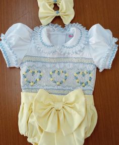 Pre-order handmade smocked romper. Fabric is cotton cotton. It takes 3-6 weeks to ship. Thank you for your patience.  Thank you for supporting a small business.  Clothing Care Instructions Most items can be washed safely in cold water on delicate cycle and hung to dry. If the item that you are ordering has red or another bright color in it next to a white or other light color fabric please use a Shout color catcher for the first few washes to avoid bleeding. The reds are pre-washed but they are Cute Cotton Bubble Romper With Smocked Bodice, Cute White Bubble Romper With Smocked Bodice, Cute White Bubble Romper With Smocked Back, White Cotton Bubble Romper With Smocked Back, White Cotton Smock Bubble Romper, White Smocked Cotton Bubble Romper, Baby Smocked Outfits, Disney Smocked Outfits, Summer Baptism Smocked Dress With Smocked Back