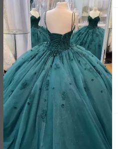 Embellished with floral appliques and intricate embroidery, this green quinceanera dresses gown is designed to make you feel like a princess. It features striking soft floral appliques and has a sweetheart neckline leading to a corset-style bodice. The A-line skirt with pleats flares into a full-length. This Ball Gown Beaded Green Quinceanera Dress is a stunning option perfect for special events. Featuring an allover beaded design, spaghetti straps, and a full ball gown skirt, you'll be the cent Emerald Green Quince Dress, Emerald Green Quinceanera Dresses, Green Quince Dress, Emerald Green Quince, Green Quinceanera Dresses, Green Quince, Sweet 15 Dresses, Cheap Formal Dresses, Pretty Quinceanera Dresses