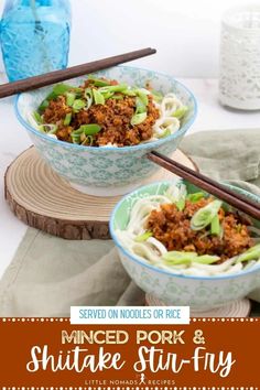 two bowls of minced pork and shiitake stir fry with chopsticks