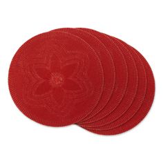 four red coasters with a flower design on them