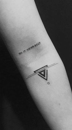 a black and white photo of a tattoo with the words do it yourself