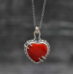 ♦Special Features: This necklace features a red Rosarita heart set in sterling silver. Rosarita isn't a stone but a glass slag from the gold mining industry from the 60's and 70's in Alaska. The beach sand would be refined and smelted for its gold content in these vats right on the beach. Because the process wasn't a perfect way to extract all the gold from the sand the resulting slag that built up is colored red from the gold left behind. I do love this material and it is so pretty with the var Artisan Red Jewelry For Anniversary, Red Sterling Silver Necklace With Heart Pendant, Sterling Silver Heart-shaped Jewelry With Large Pendant, Heart-shaped Sterling Silver Gemstone Necklace, Sterling Silver Heart-shaped Gemstone Necklace, Artisan Red Collectible Necklaces, Artisan Heart-shaped Jewelry For Anniversary, Artisan Sterling Silver Heart Necklace, Sterling Silver Jewelry With Heart Beads