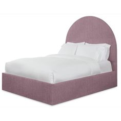 an upholstered bed with white sheets and pink linens on the headboard