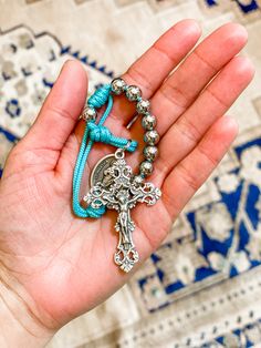 This beautiful pocket rosary features our same heavy-weight stainless steel beads and the same gorgeous fleur-de-lis, antique style crucifix as our smaller full stainless steel rosaries but is only a decade long. This makes it the ideal option to carry in your purse or pocket, or to keep in your car. Pray just a decade or repeat the decade 5 times for a complete rosary. These pocket rosaries are a wonderful gift for loved ones, or for yourself. Made of stainless steel beads, paracord and an Ital Adjustable Spiritual Rosary With Cross Pendant, Adjustable Rosary With Miraculous Medal And Crucifix, Silver Rosary With 8mm Beads And Crucifix, Adjustable Silver Crucifix Rosary, Adjustable Silver Rosary With 8mm Beads, Silver Cross-shaped Rosary Bracelet With 8mm Beads, Saint Martha, Chaplet Rosary, Confirmation Gifts