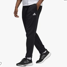 100% Polyester Care Instructions Machine Wash Origin Imported Closure Type Pull On About This Item Men's Tapered Sport Pants Made For Casual Wear Made From Water-Absorbent Materials Designed To Wick Moisture Away From Your Body, Adidas Aeroready Keeps You Feeling Dry As You Move Drawcord On Elastic Waist For An Adjustable Fit Side Pockets For Storage Description The Coverage You Need For Squats And Lunges. These Men's Adidas Pants Have Tapered Legs And A Drawcord Elastic Waist For A Just-Right F Casual Adidas Straight Leg Pants, Adidas Casual Straight Leg Pants, Adidas Casual Trousers, Adidas Casual Tapered Leg Pants, Casual Adidas Sweatpants, Adidas Jogging Pants With Pockets, Adidas Jogging Bottoms With Pockets, Adidas Moisture-wicking Joggers For Streetwear, Adidas Moisture-wicking Sweatpants For Jogging