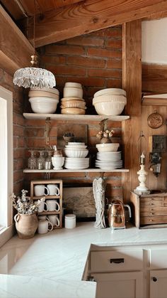 a kitchen filled with lots of white dishes