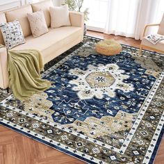 a living room filled with furniture and a blue rug