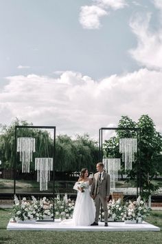 a bride and groom standing at the end of their wedding ceremony