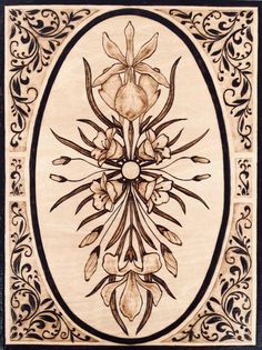 an intricately designed wooden plaque with flowers