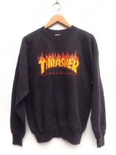 "Please read all description carefully before buying. If you have any questions feel free to ask. Vintage 90's Thrasher Magazine Flame Sweatshirt Colour : Black Size on tag : L Brand : Thrasher Condition : Good vintage condition but slightly faded. MEASUREMENT Armpit to armpit : 23\" Shoulder to bottom hem : 26.5\" PLEASE CHECK ACTUAL SIZE CAREFULLY, NO RETURNS OR COMPLAINT FOR WRONG SIZE ACTUAL. ACCEPT PAYPAL ONLY. Shipping cost=$28 via DHL Express Shipping. Transit time can take 3-5 business d 90s Winter Streetwear Tops, 90s Style Winter Streetwear Tops, 90s Style T-shirt For Fall Streetwear, 90s Style Streetwear Tops With Ribbed Cuffs, 90s Style Ribbed Cuffs Tops For Streetwear, 90s Style Tops With Ribbed Cuffs For Streetwear, Casual Fall Skateboarding Sweatshirt, Casual Long Sleeve Tops For Skateboarding, Casual Fall Sweatshirt For Skateboarding