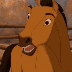 the horse is smiling and standing in front of a wooden fence as if it were from disney's live - action movie