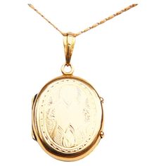 Old Swedish Pendant / Locket in solid 18K Yellow Gold. Fine hand-engraved ornaments on both sides. One internal removable bezel inside, no glass. All parts tested 18K Yellow Gold. Bail with worn Swedish hallmarks, date code likely O6 / 1892. 35 mm long suspended including the hanger x 20 mm wide x 7 mm deep. Weight: 4.5 grams. Used fine condition, with very minor dents, and scratches. This pendant sells without a chain. > Most of the items that we sell are not new at all if not stated otherwise. Vintage 22k Gold Engraved Jewelry, Heirloom 22k Gold Oval Jewelry, Traditional Oval Pendant Jewelry For Formal Occasions, 22k Gold Engraved Medallion Jewelry, Classic 22k Yellow Gold Jewelry, Antique 22k Yellow Gold Jewelry, Antique Engraved Gold-plated Jewelry, Antique Engraved Gold Plated Jewelry, Antique Gold Plated Engraved Jewelry