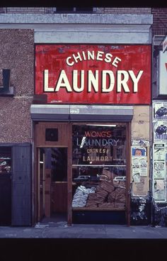 a chinese laundry store on the side of a building