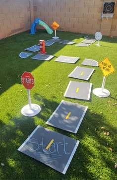 the lawn has been decorated with various signs and markers for children to learn how to walk