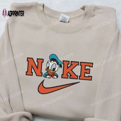 Introducing our adorable Baby Donald Duck x Nike Embroidered Sweatshirt! Made with love, this sweatshirt combines the charm of Disney’s Baby Donald Duck, Nike Ideas, Nike Embroidered Sweatshirt, Nike Hoodies, Nike Inspired, Disneyland Family, Nike Embroidery, Comfy Sweatshirts, Embroidered Apparel