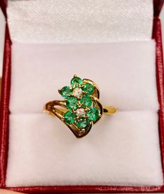 Beautiful Vintage 14k Yellow Gold Natural Fine Quality Round Shape Emerald Ring 100% Natural Emeralds And Diamonds Emerald(s) 1.00CT Diamond: 0.08CT Color: G Clarity: SI1 Total ring weight: 3.9GR 14k Yellow Gold Ring sizing available free of charge For more information regarding this item feel free to reach me so I can accommodate your needs. Thank you Yellow Gold Cluster Emerald Ring Fine Jewelry, Cluster Emerald Ring In Yellow Gold With 17 Jewels, Formal Yellow Gold Cluster Ring With Emerald, Yellow Gold Cluster Rings With Multi-stone, Yellow Gold Multi-stone Jewelry For Anniversary, Anniversary Multi-stone Yellow Gold Jewelry, Exquisite Yellow Gold Cluster Diamond Ring, 14k Gold Emerald Ring Fine Jewelry, Yellow Gold Cluster Ring In Fine Jewelry Style