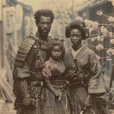 an old photo of two people and a child