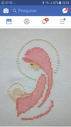 the cross stitch pattern is in progress